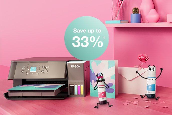 An Epson Printer with Inkies and postcards, a letter against a pink wall and a shelf with books and office materials in different colours.