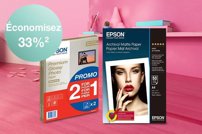 2 Epson Paper Packs lined up against a pink desk and shelf, with paper hearts on the desk.