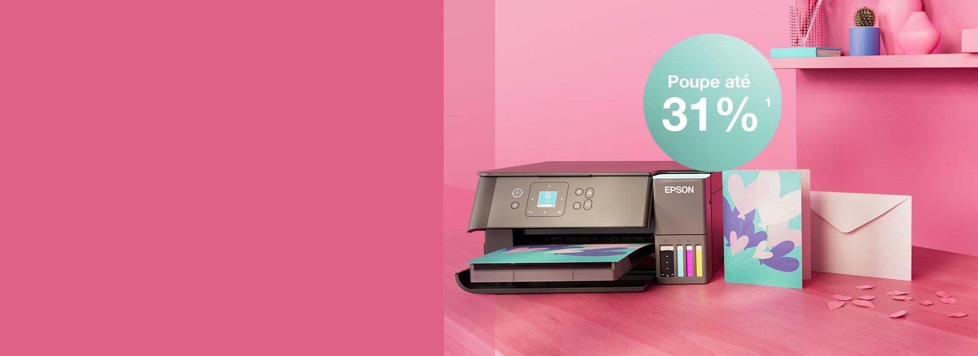 An Epson Printer with Inkies and postcards, a letter against a pink wall and a shelf with books and office materials in different colours.