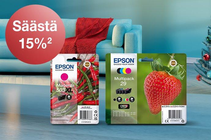 Epson Ink cartridges in different colours with a blue couch and red blanket in the background