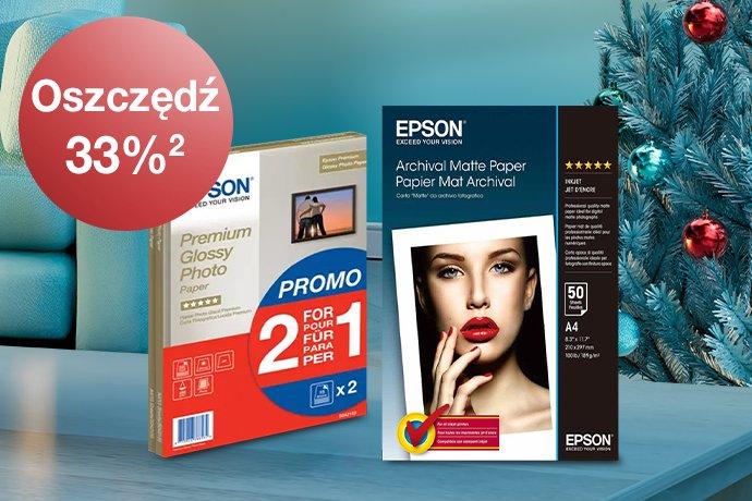 Epson Paper packs with a blue couc, red blanket and a Christmas tree in the background