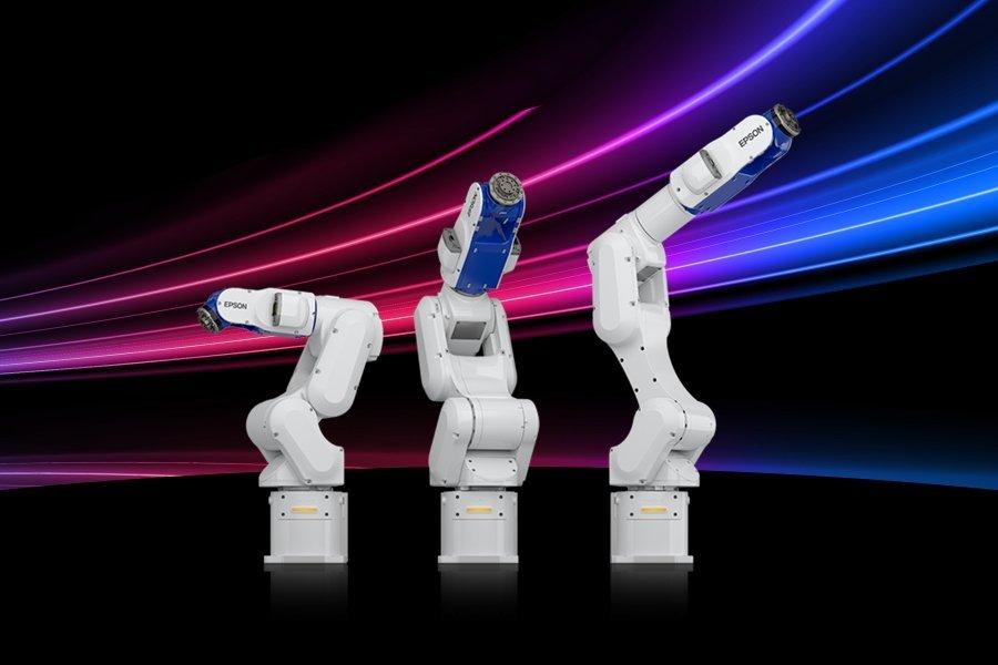 Epson Six Axis robots, with red and blue neon lighting in the background.