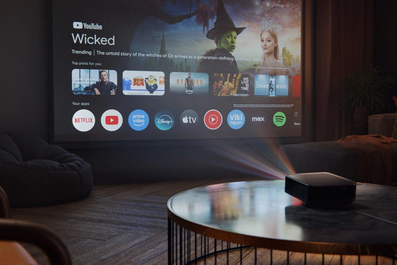 A home theatre setup with a projector displaying a streaming interface on a screen. Apps like Netflix and Disney+ are visible. Cozy, ambient lighting.