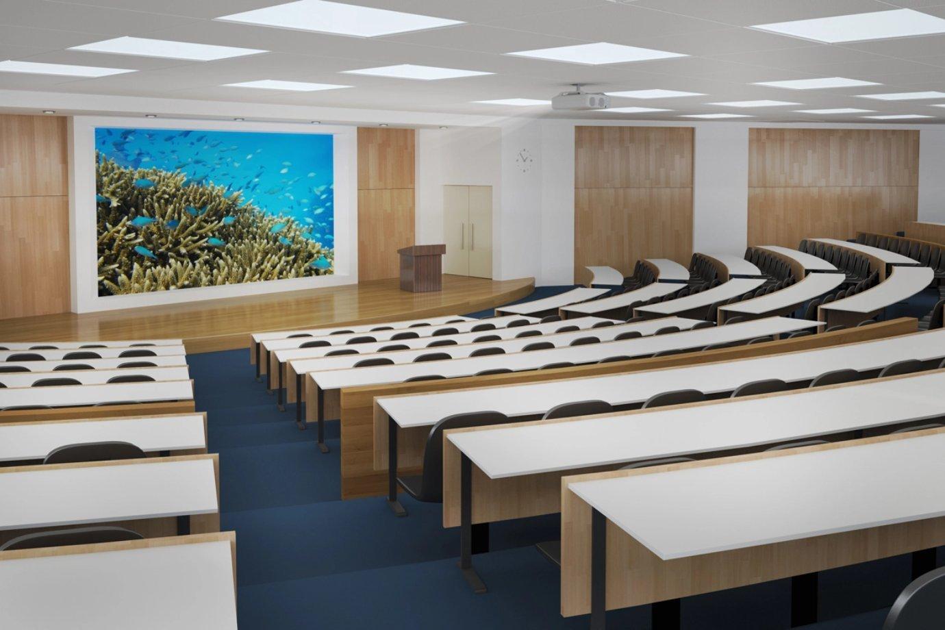 A woman presents data on a screen in a modern conference room. 