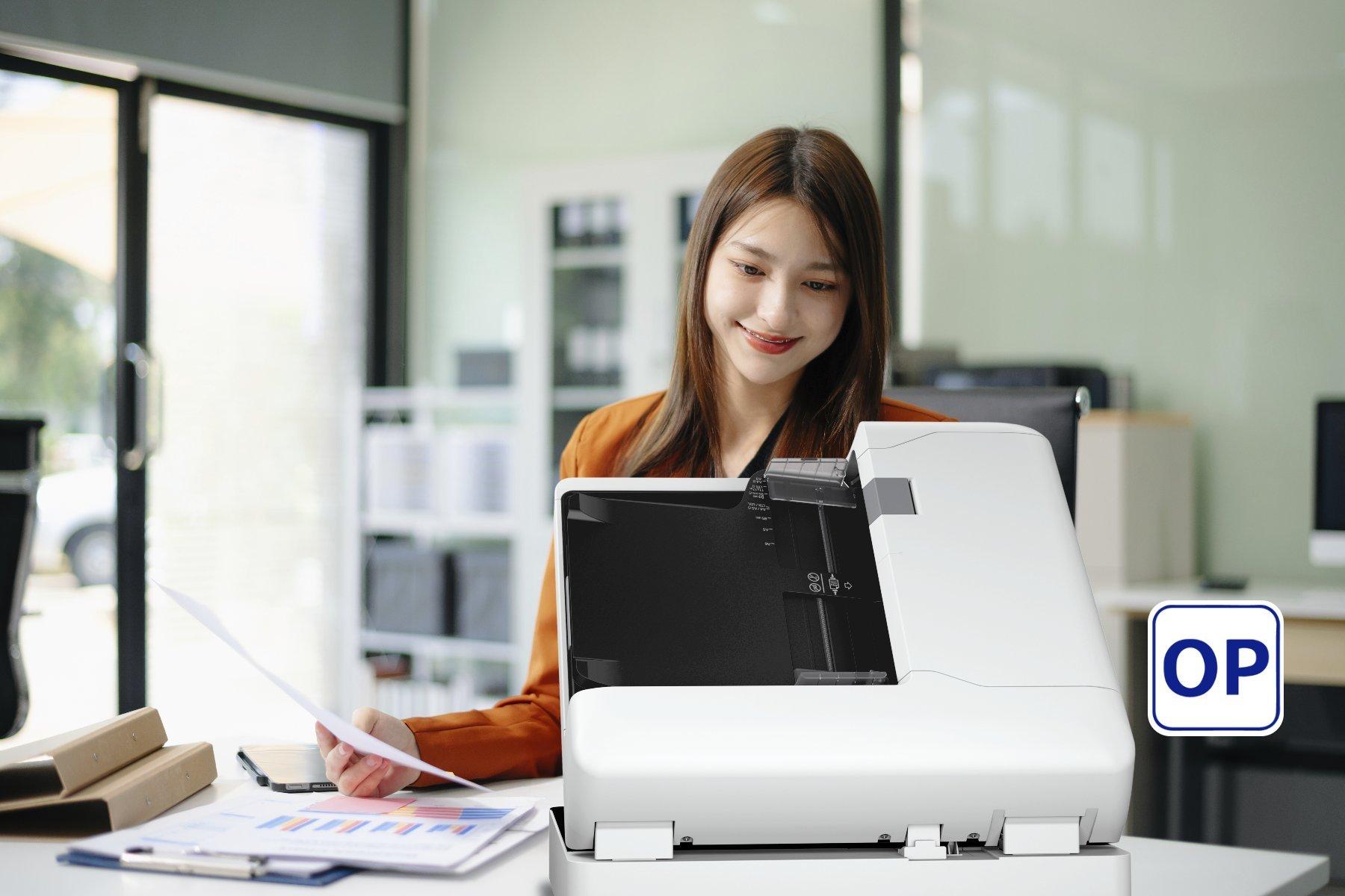 Woman using an Epson flatbed scanner