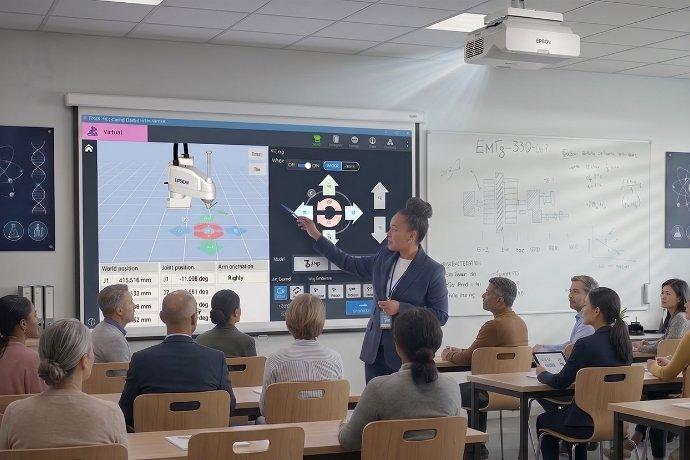 An Epson projector projecting Robots software in front of a college class.