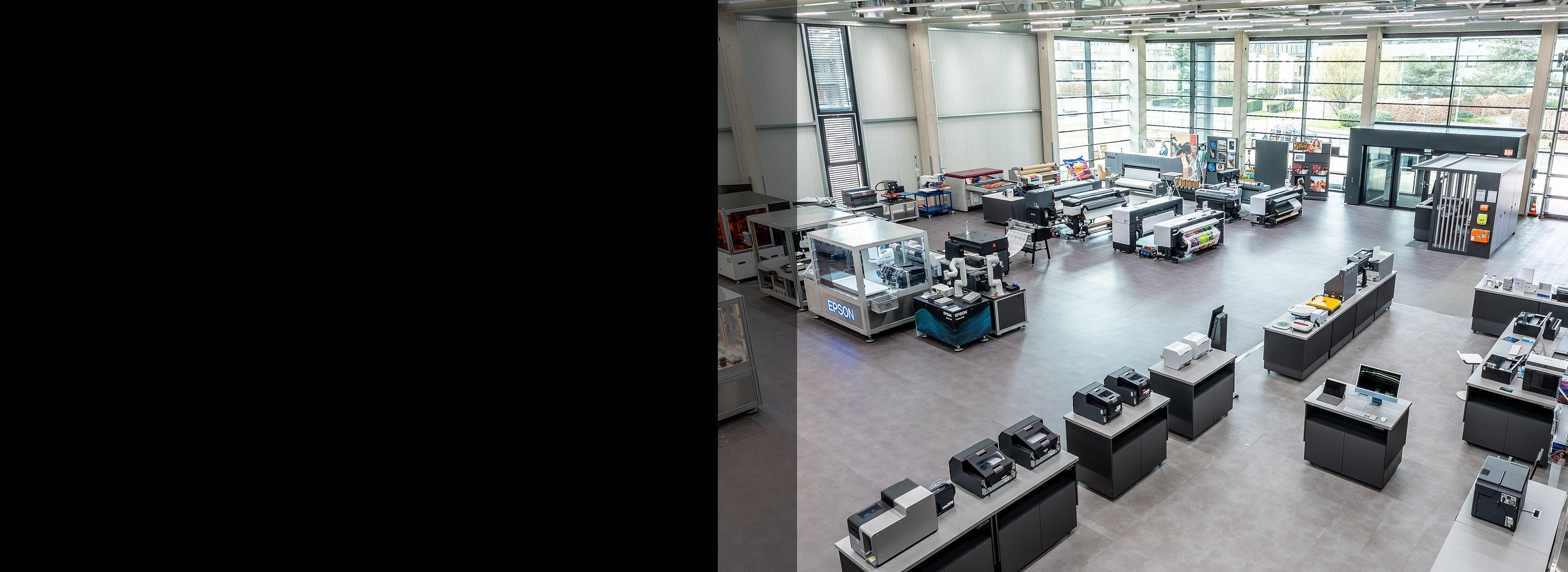 Many Epson printers on desks in their experience center