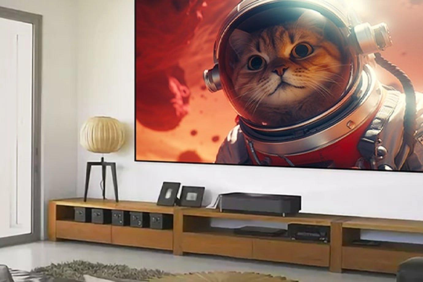 A cozy living room features a large TV displaying a cat in a spacesuit against a vibrant space background, blending whimsy with modern decor.