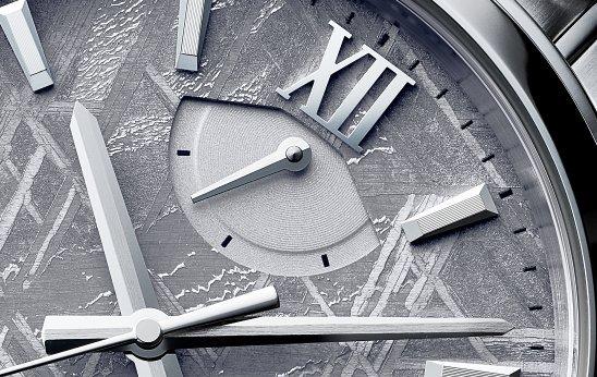 Close-up of silver Orient watch.