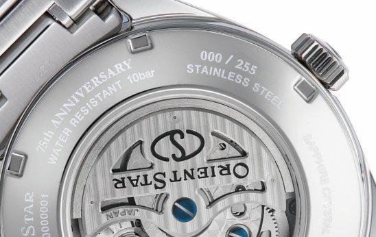 Close-up of silver Orient watch.