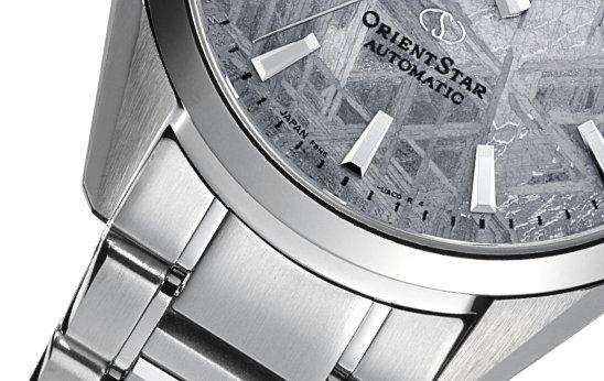 Close-up of silver Orient watch.