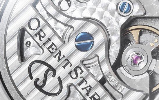 Close-up of silver Orient watch.