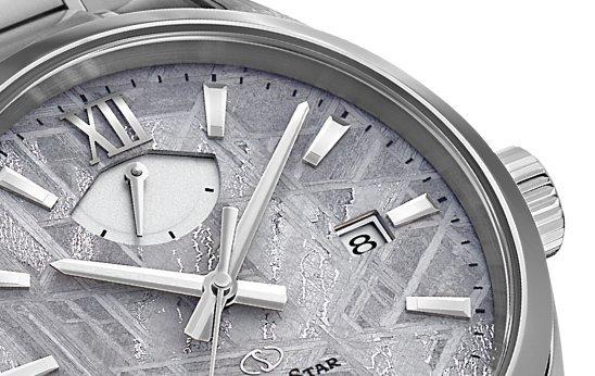 Close-up of silver Orient watch.