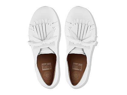 Women's white leather sneakers with fringe detail.