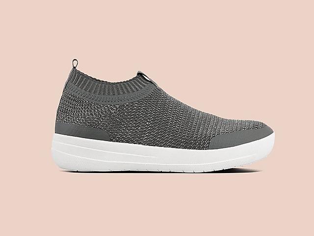 Soft, stretchy slip-on knitted sneakers featuring a metallic weave. Shown in Grey.