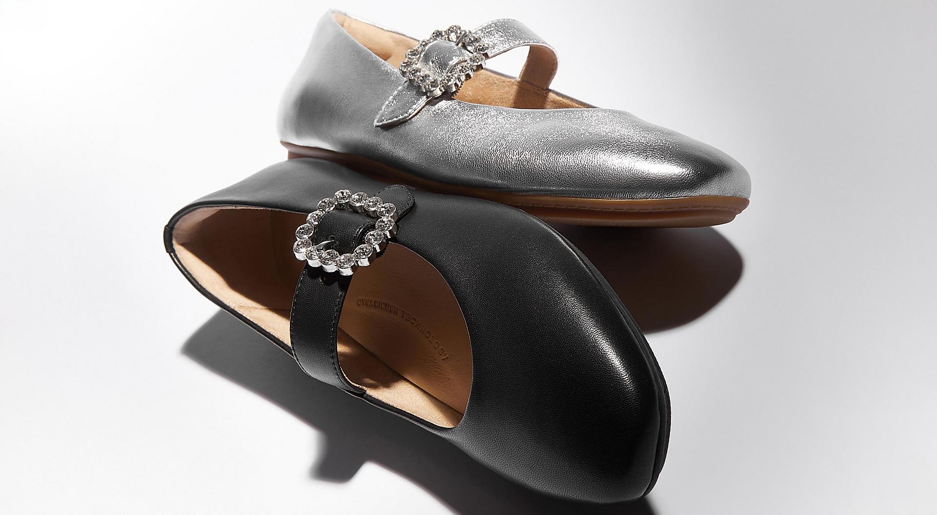 Two pairs of mary jane style ballerina shoes with a crystal buckle.