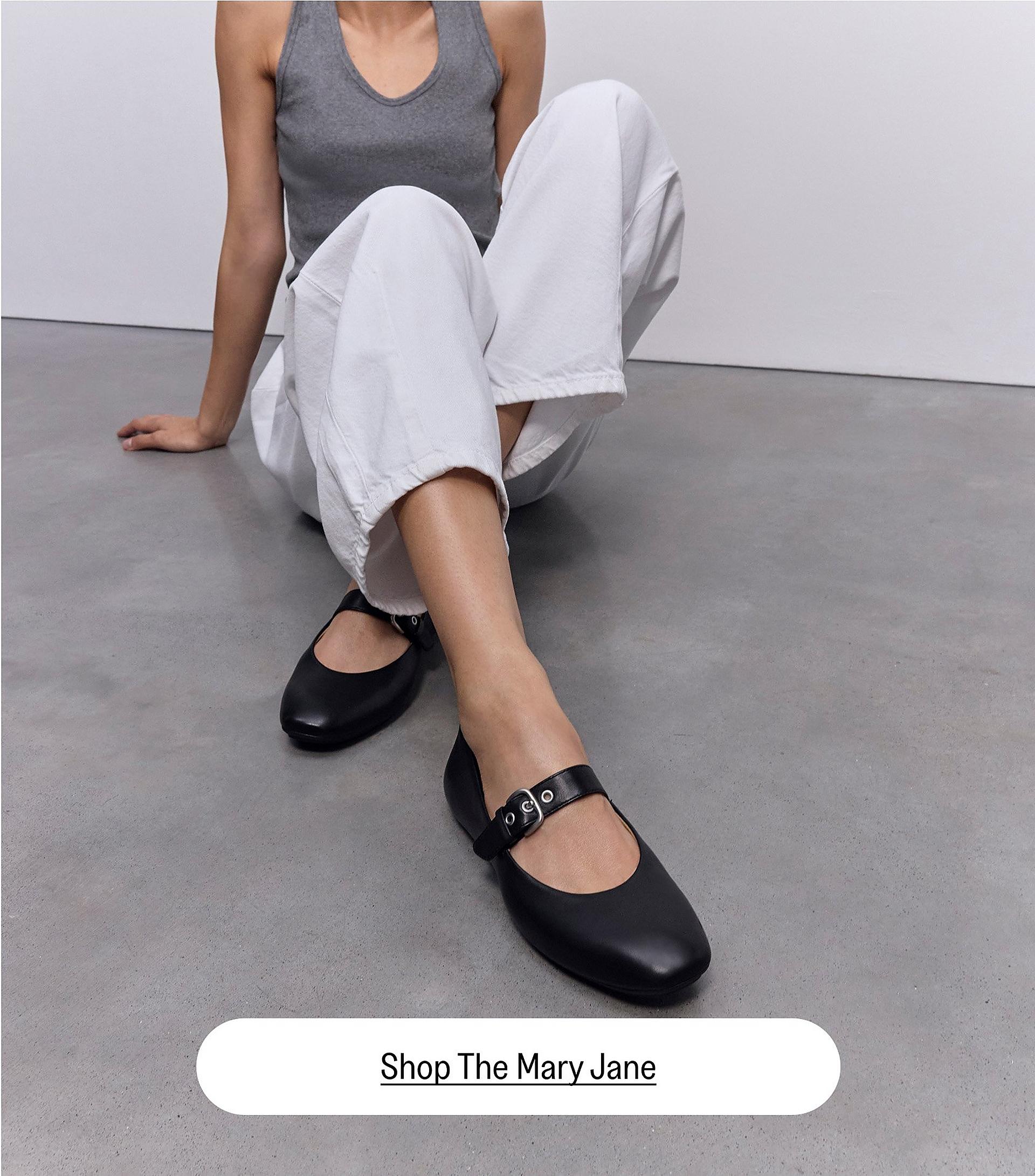 woman wearing black buckle leather mary jane