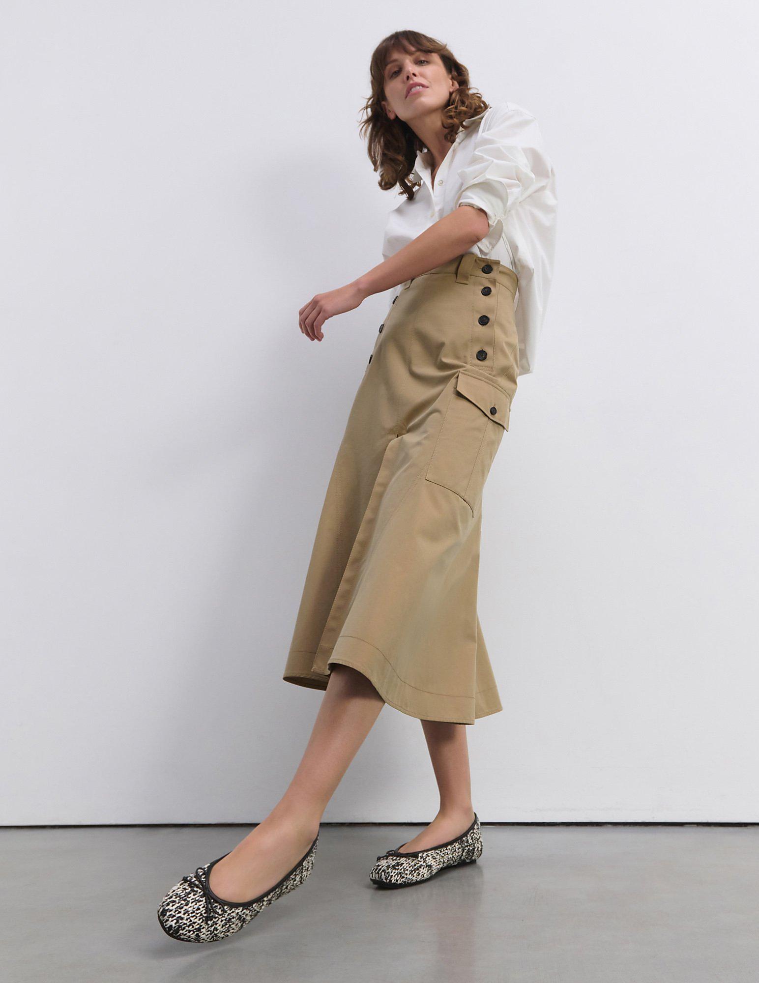 Woman wearing fitflop ballerina flat shoes from the SS25 collection