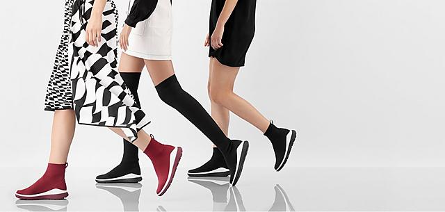 Models wearing Luxe Knit sock boots in Red and Black colour options and ankle or Knee-high styles.