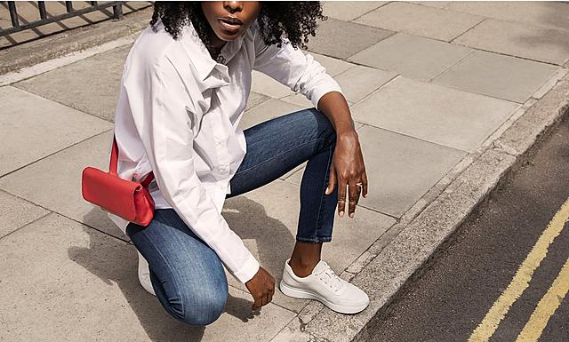 Fitflop white leather sneakers with patent detail.