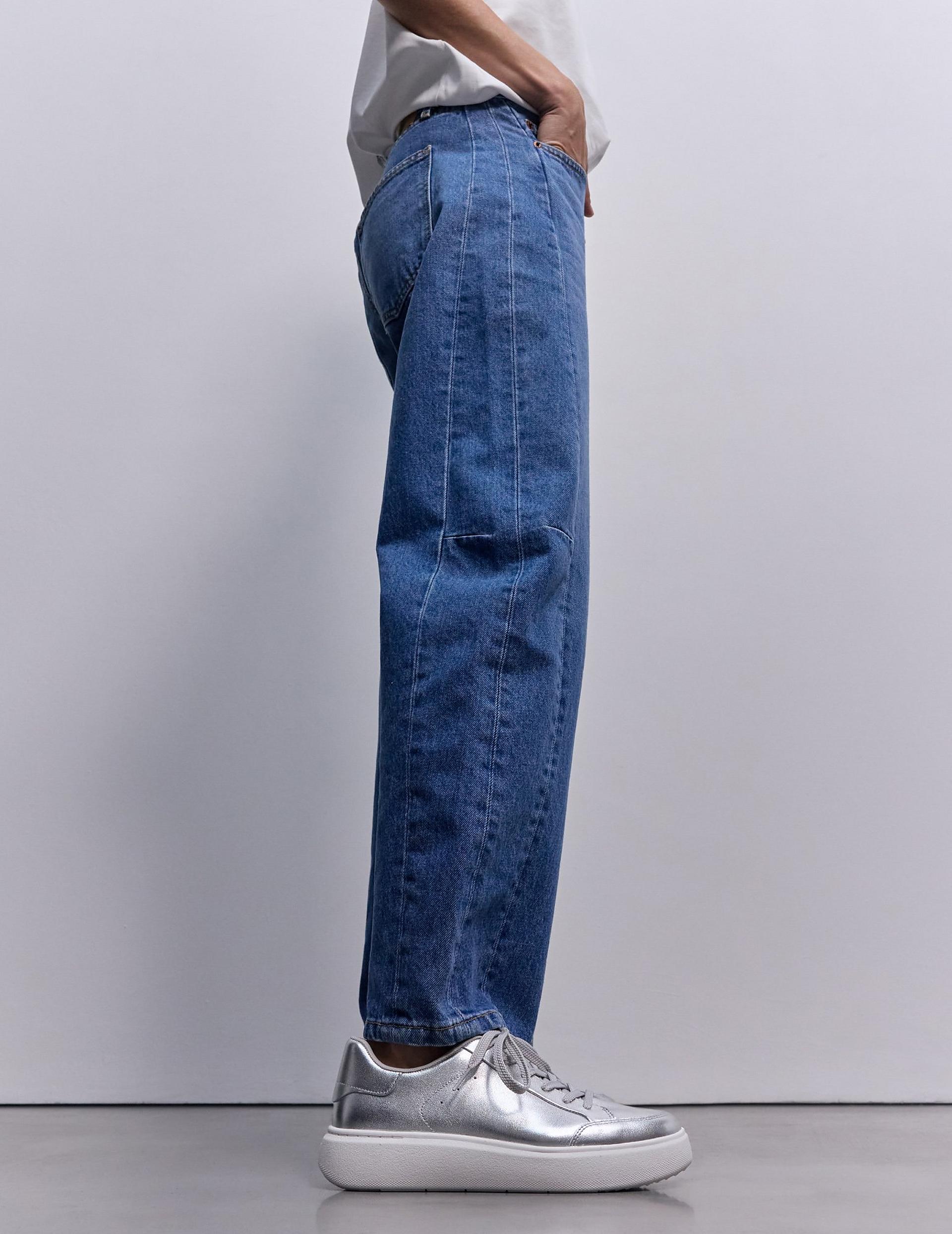 Woman wearing rtg metalic trainers