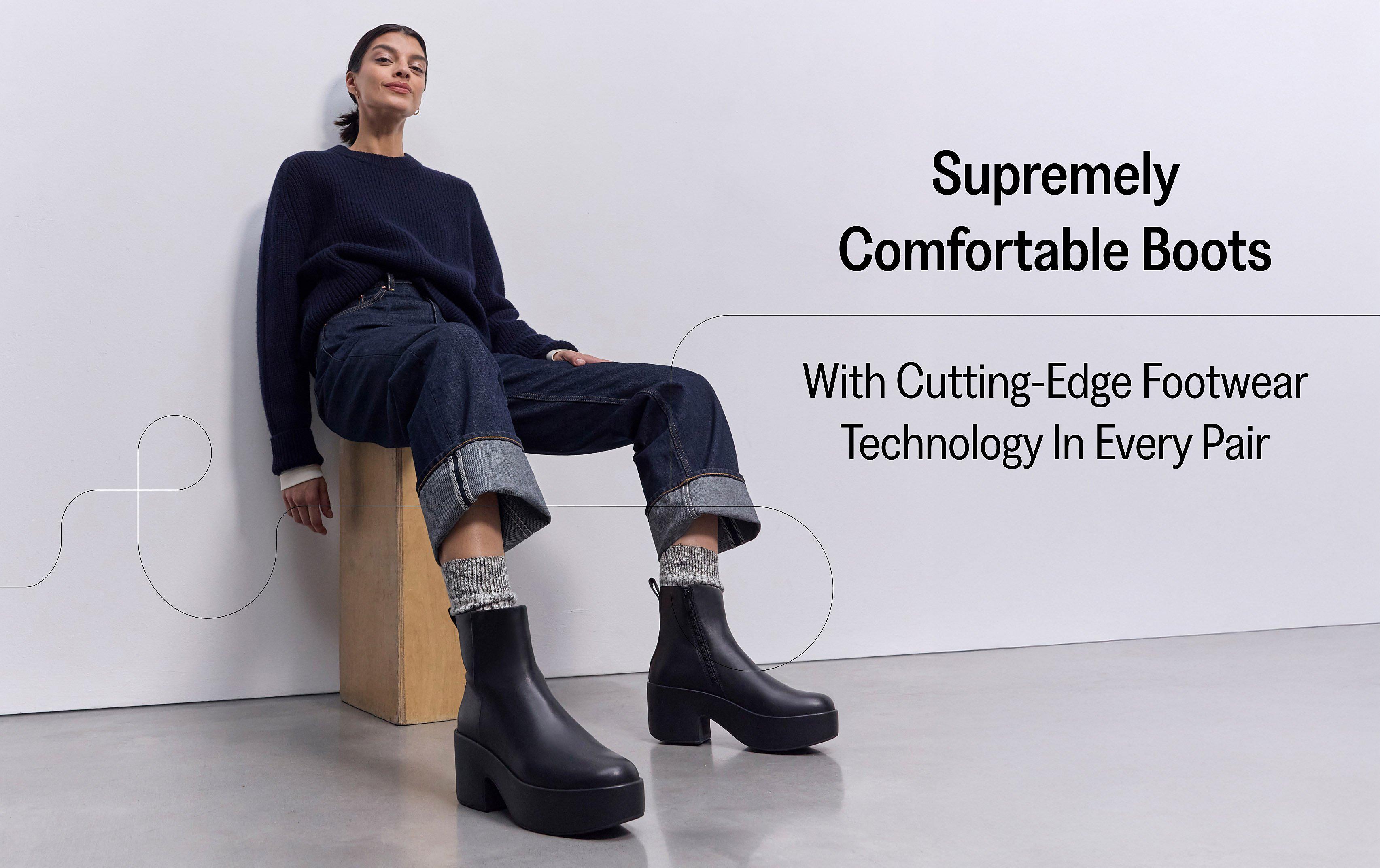 Woman Wearing sitting on a chair wearing PLATFFORMS Leather Heeled Ankle Boots From FitFlop