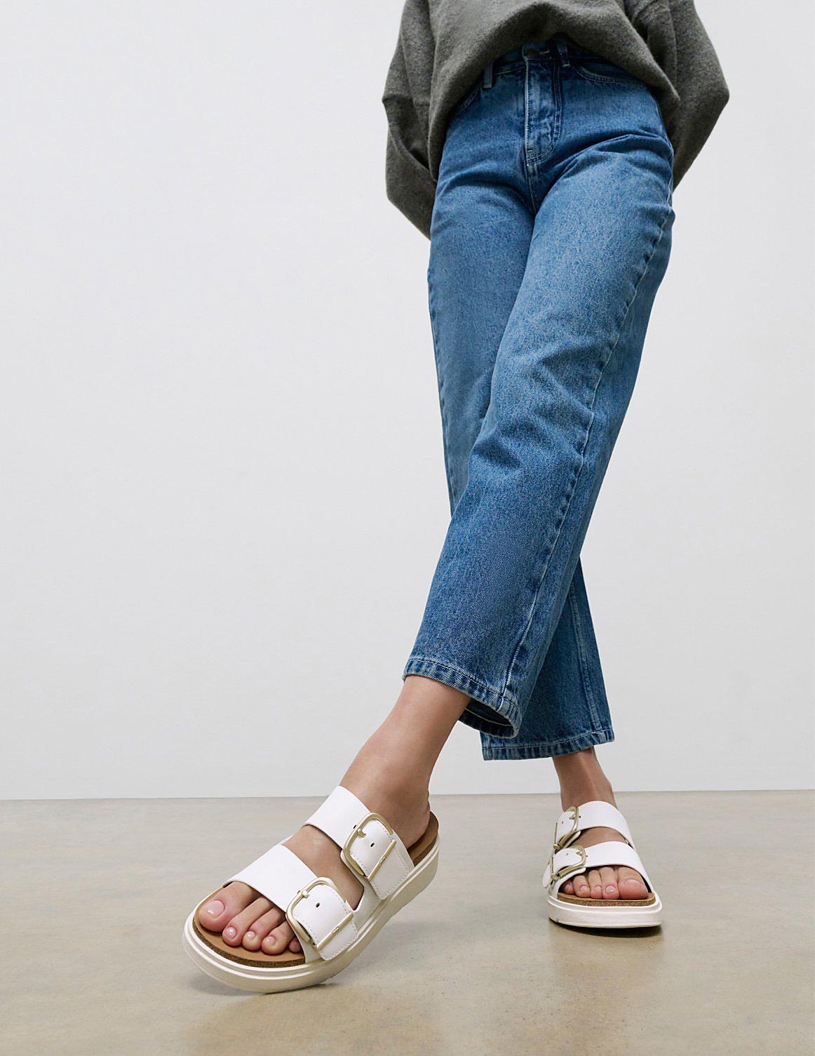 Woman Standing Up Wearing Gen FF Buckle Slides - From FitFlop US