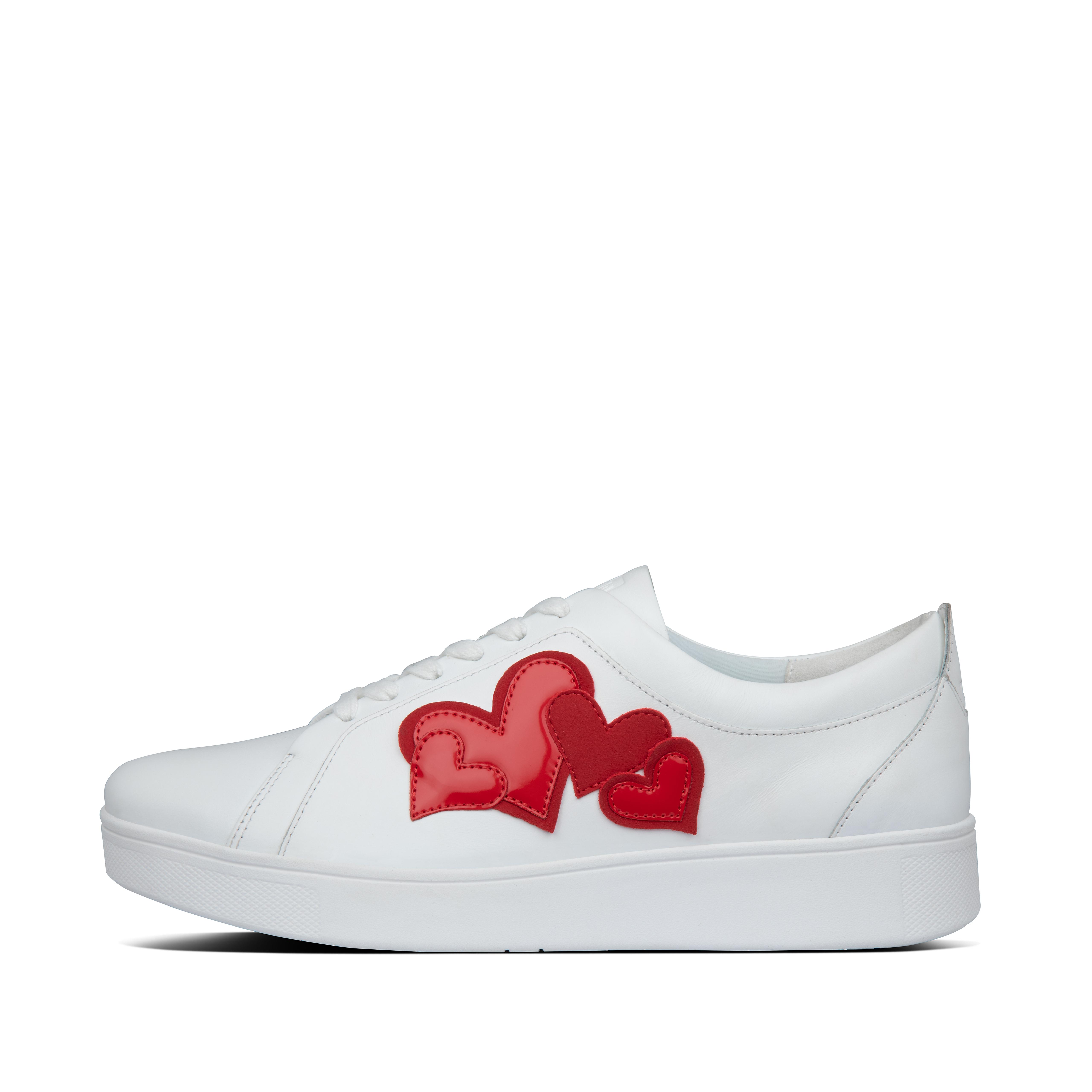 white trainers with red hearts