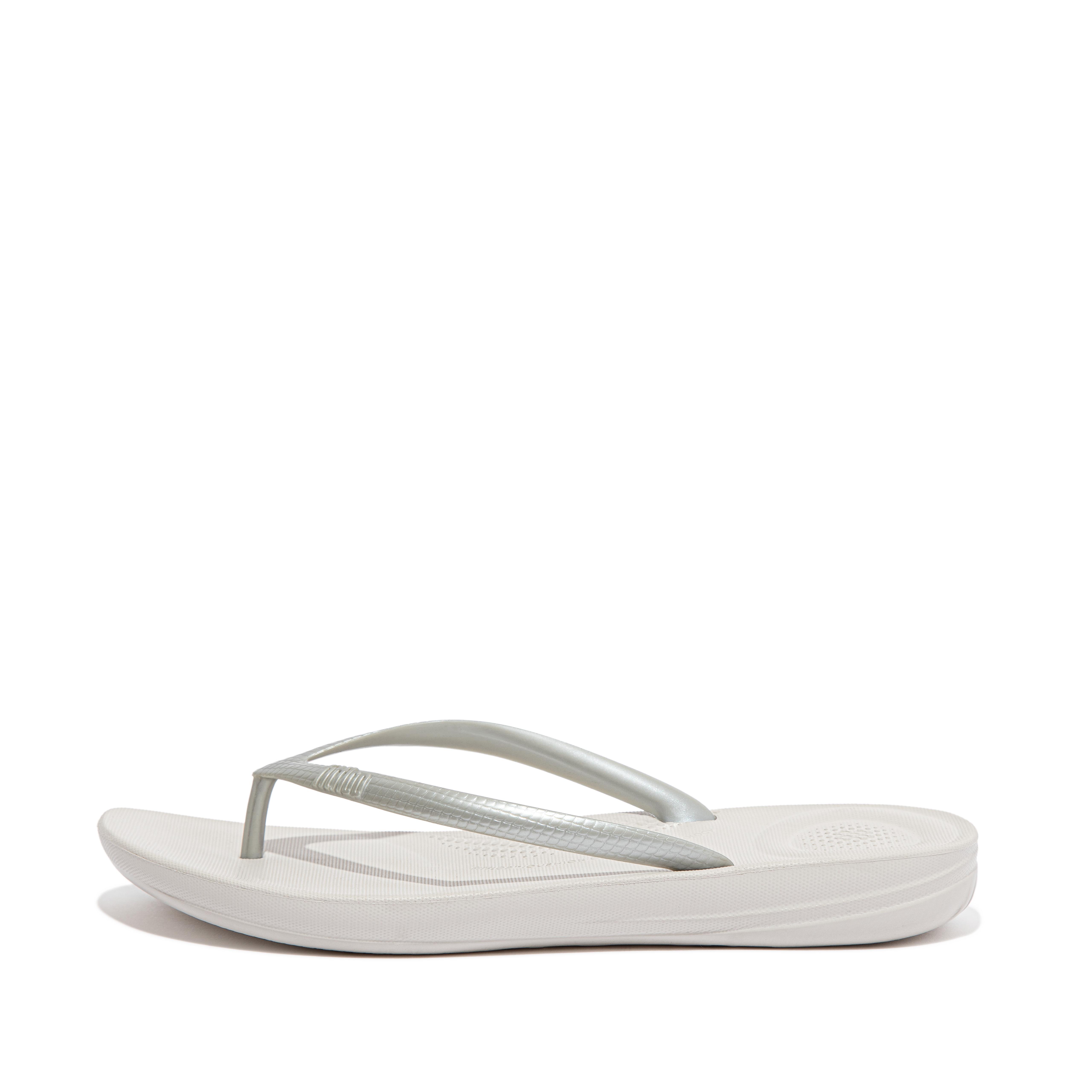 all white flip flops