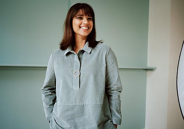 A woman in a pastel green blouse is smiling at the camera. Her name is Seetal Solanki, an author and business owner.