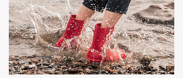 Fitflop WonderWelly, women wearing red wellington boots.