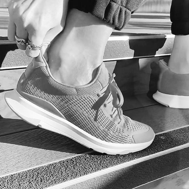 Black and white close-up image of VITAMIN FFX running trainer.