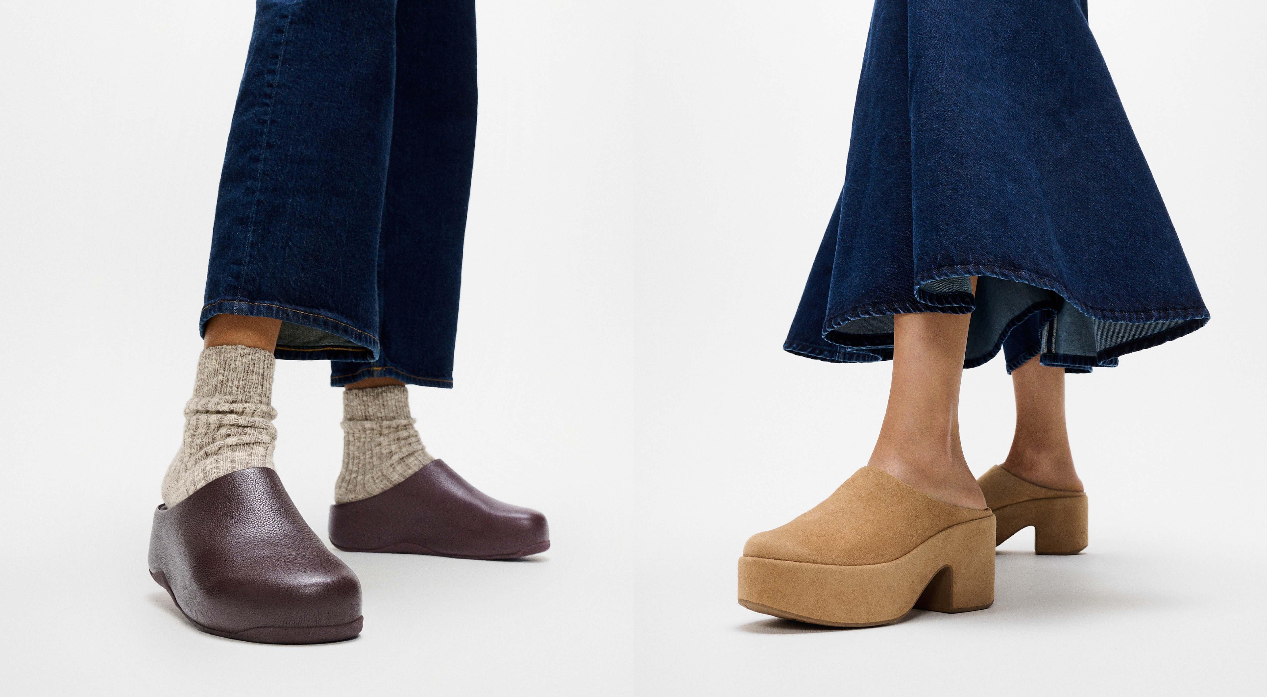 A model wearing a pair of platform clogs in a camel brown colour