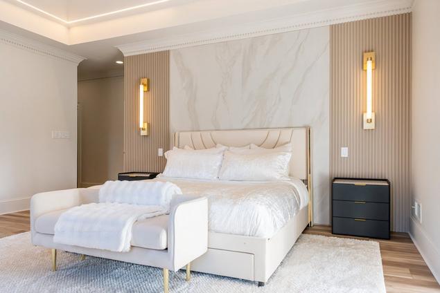 Andover White XL Porcelain Slab behind the headboard in the primary bedroom.
