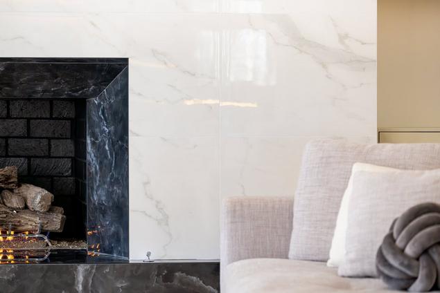 Close-up of fireplace with Andover White Porcelain Tile.