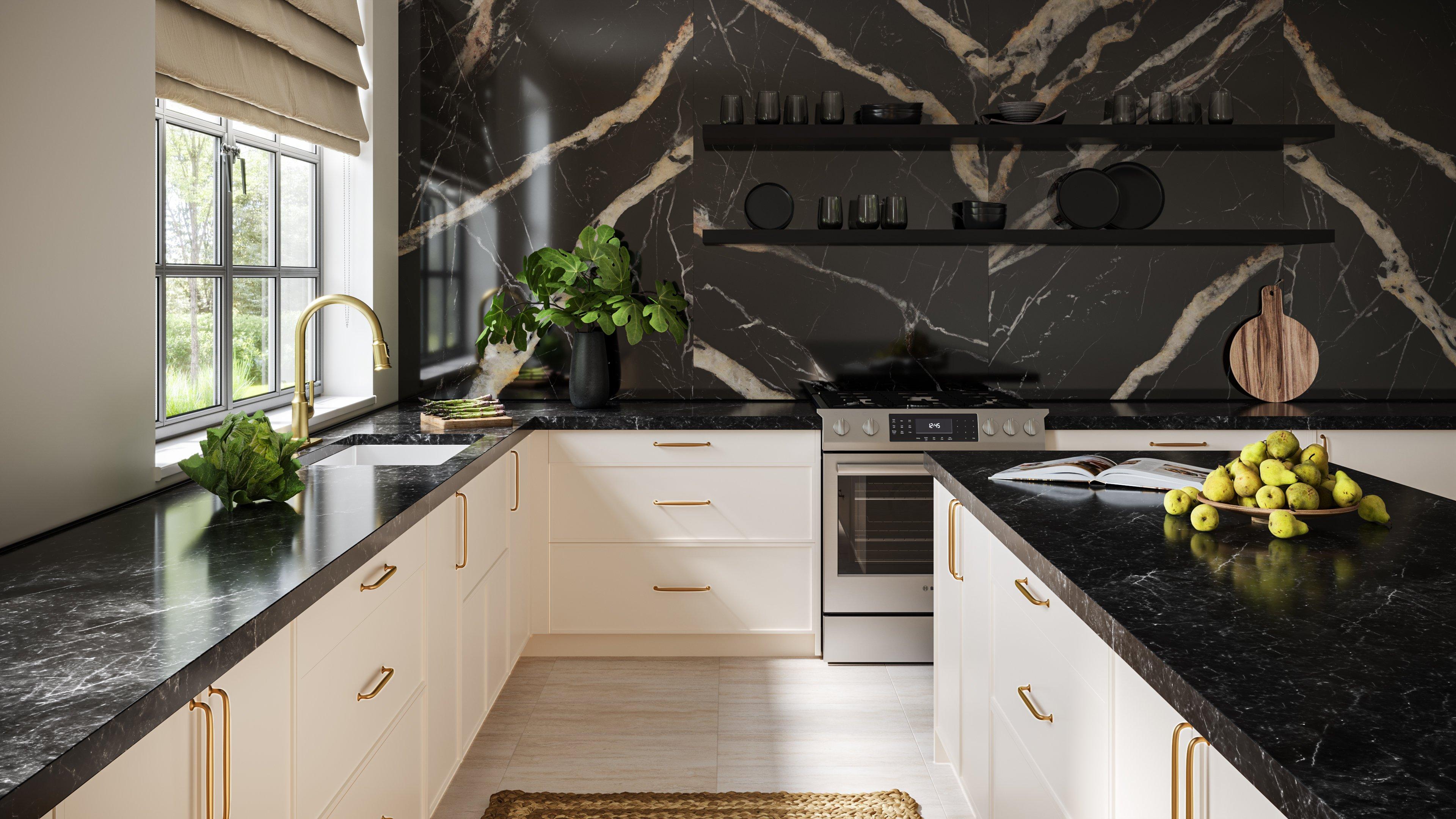Kitchen with black countertops, stone-look backsplash, and white cabinets.