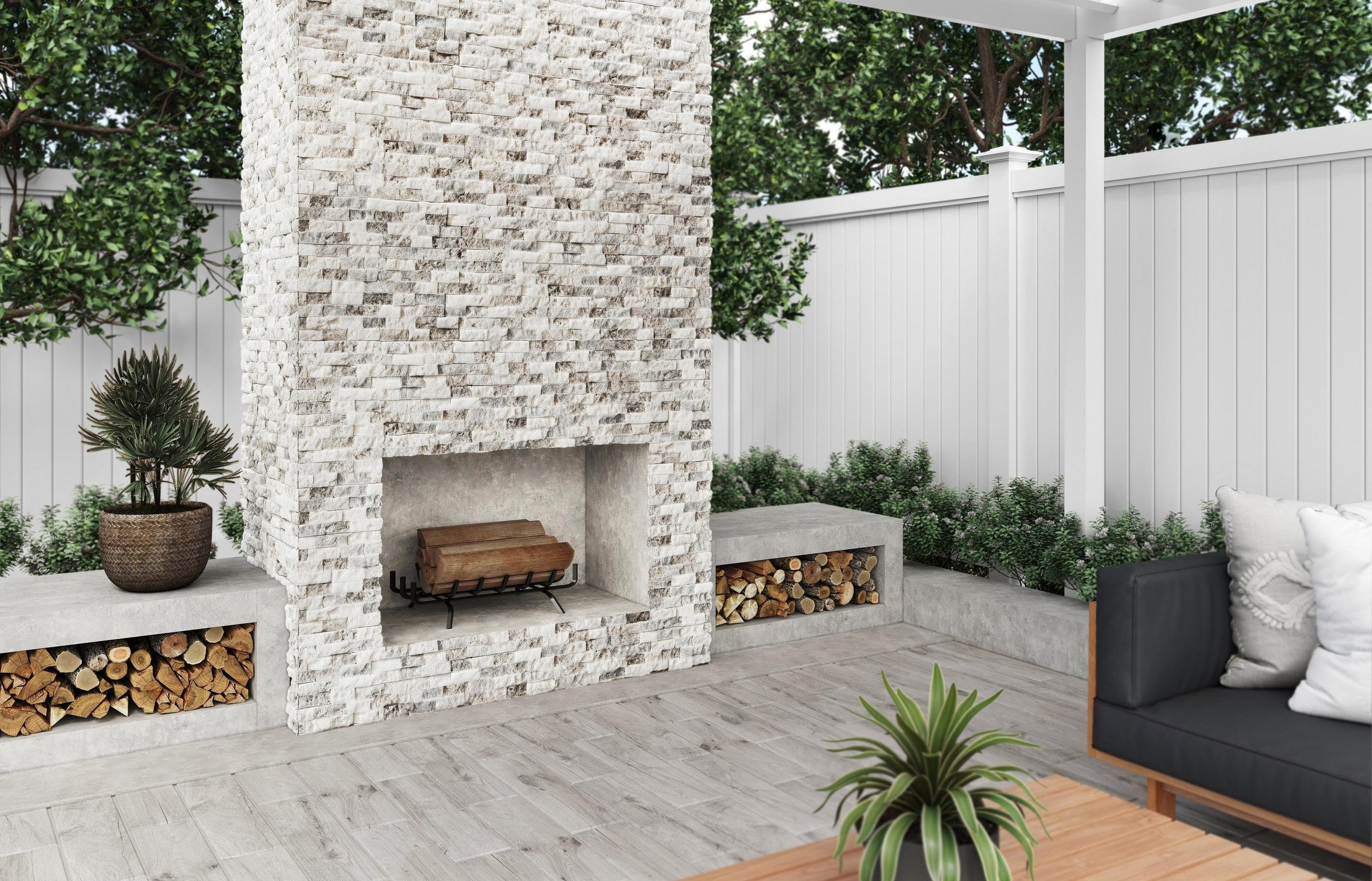 Outdoor seating area with white stone ledger fireplace.