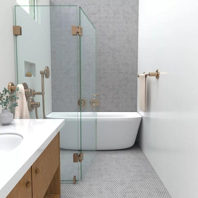 Accent shower wall with gray penny tile and white grout. 