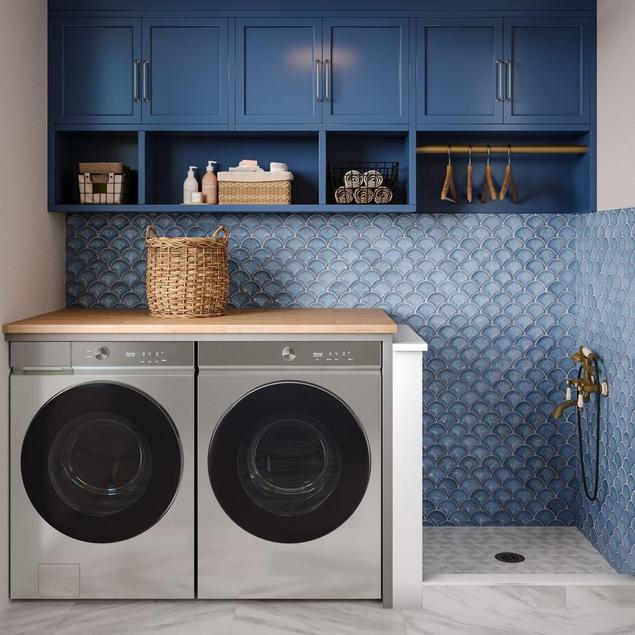 Dog washing room with blue mosaic wall tile, white hexagon mosaic shower tile, and blue cabinets.