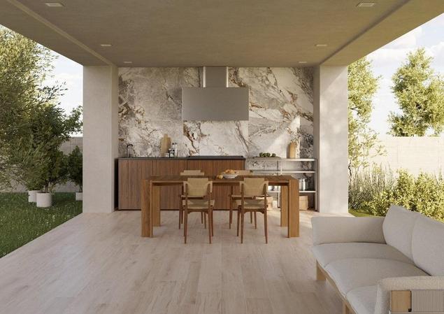 Covered outdoor kitchen with dining and seating area