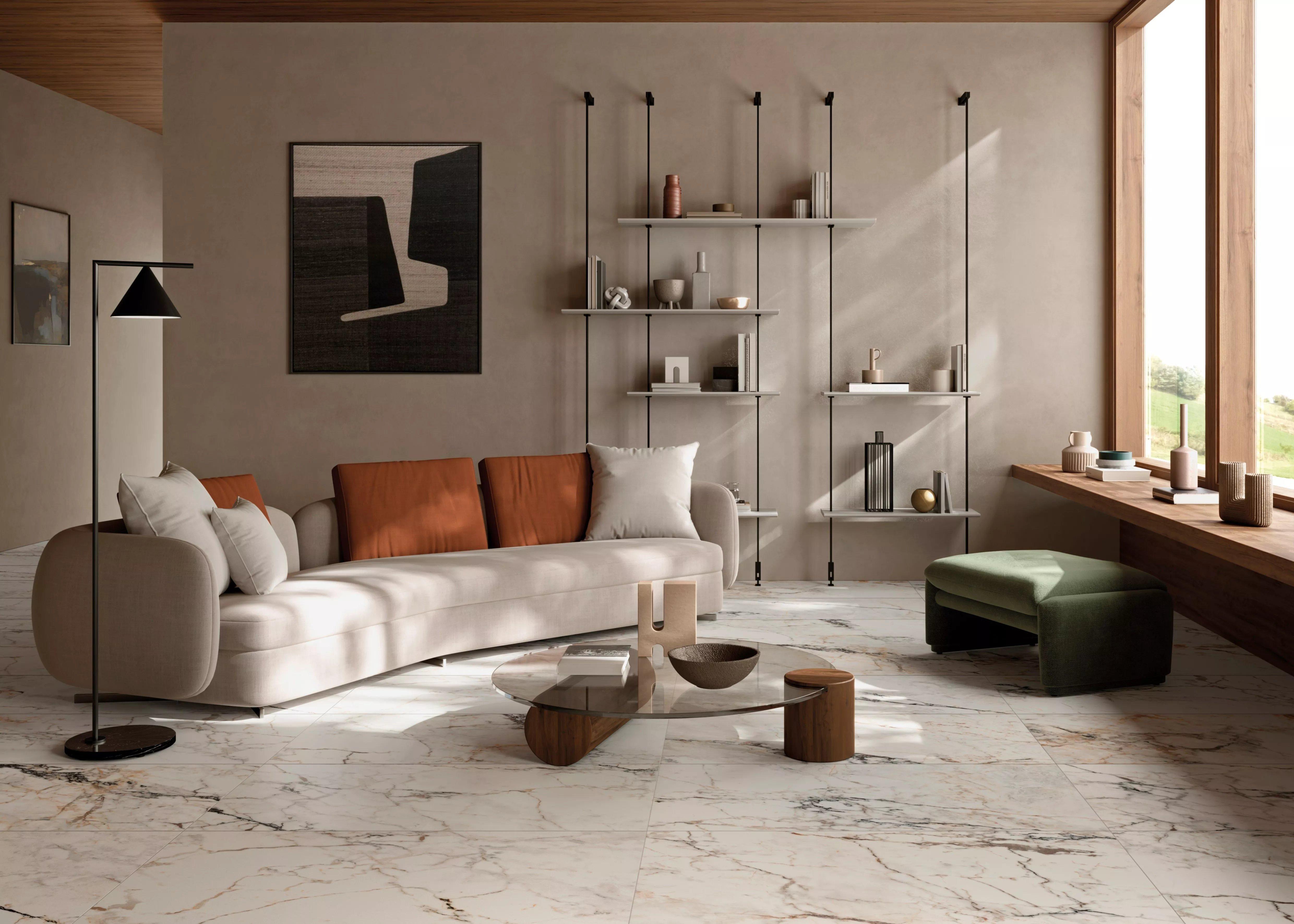 Living room with white marble-look porcelain tile flooring. 