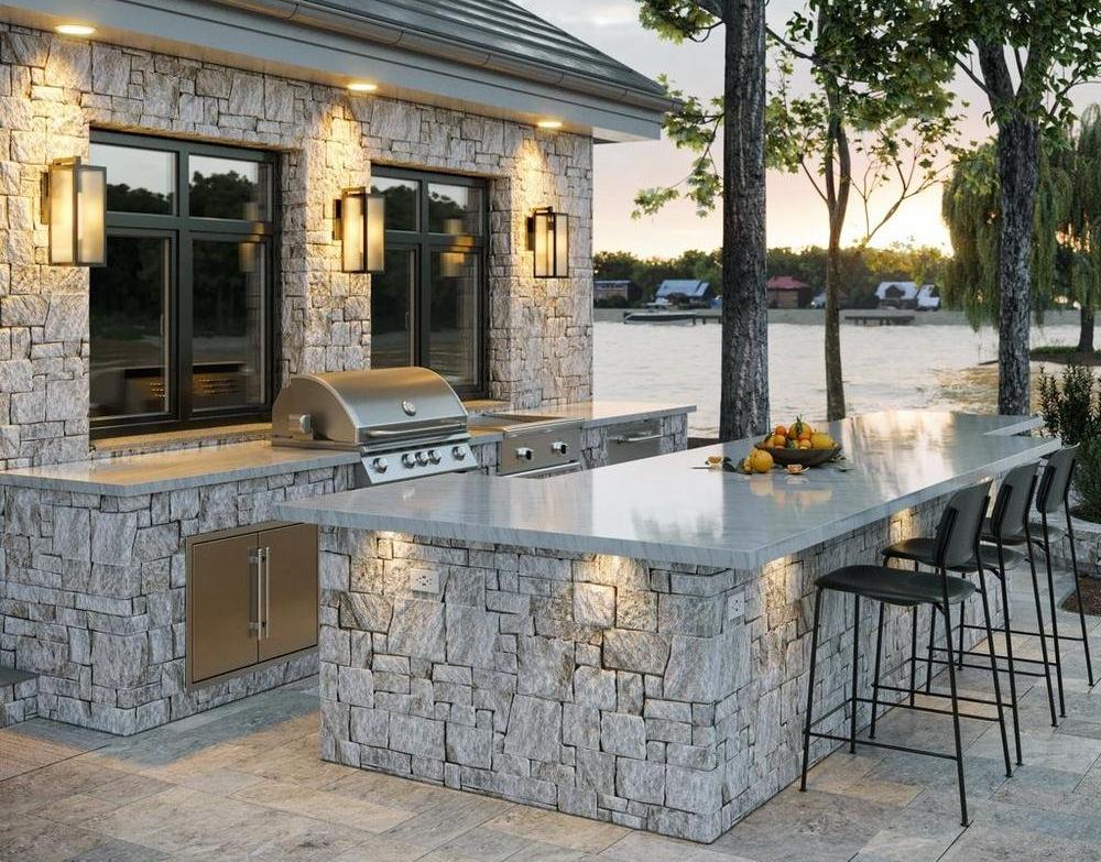 Outdoor kitchen with grilling station and stacked ledger counters