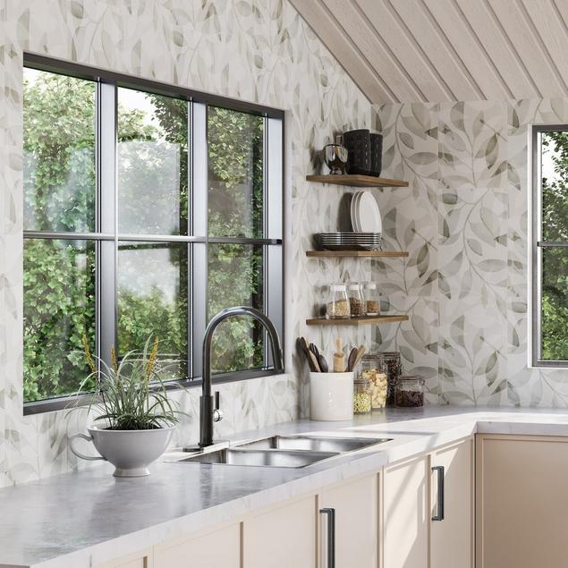 Kitchen with white botanical tile backsplash.