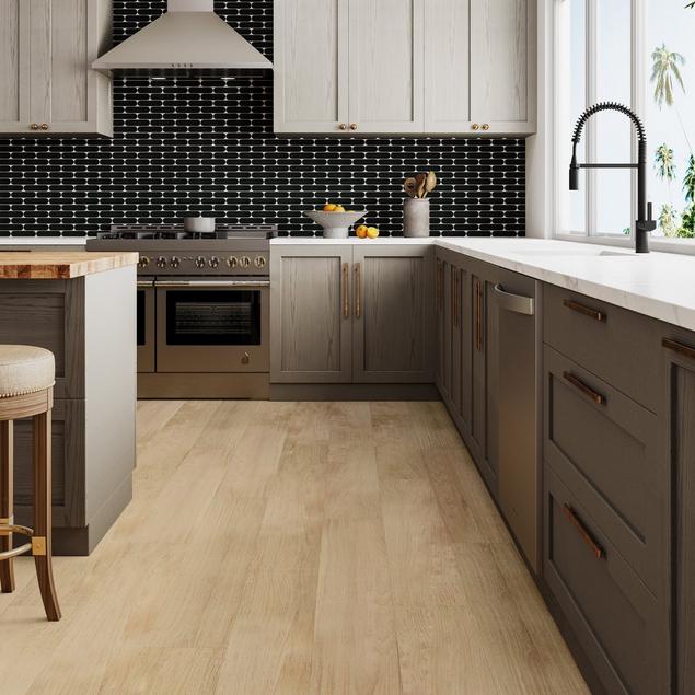 Kitchen with black mosaic backsplash and light blonde wood-look NuCore Performance flooring.