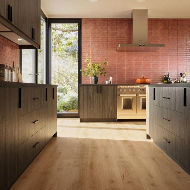 Kitchen with copper color backsplash, wood cabinets, and light blonde wood-look HydroShield Plus.