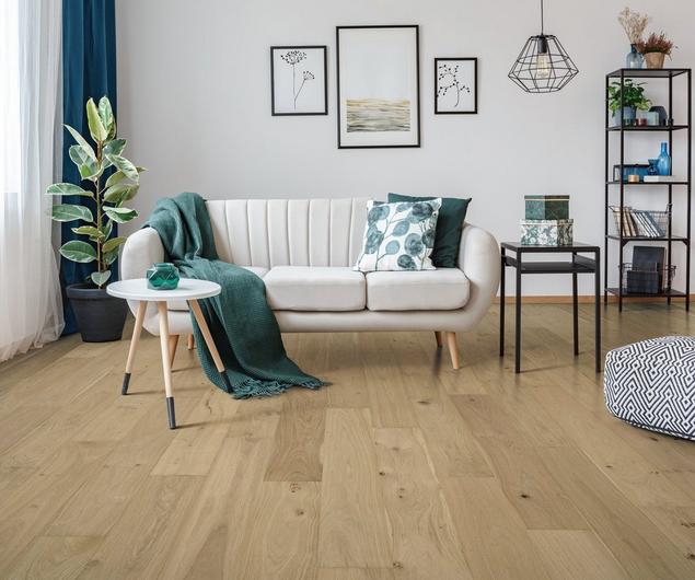 Living room with blonde engineered hardwood and a clean look. 