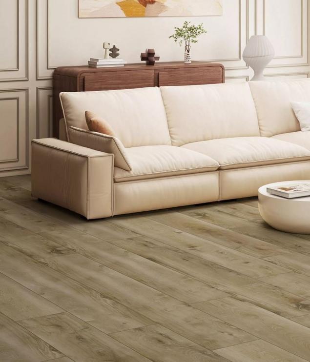 Cream color living room with medium-light gray luxury vinyl plank flooring.