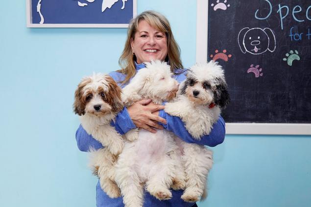 Andrea with 3 puppies