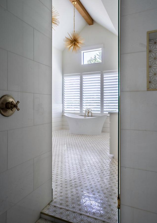 Marble mosaic shower with gold detailing