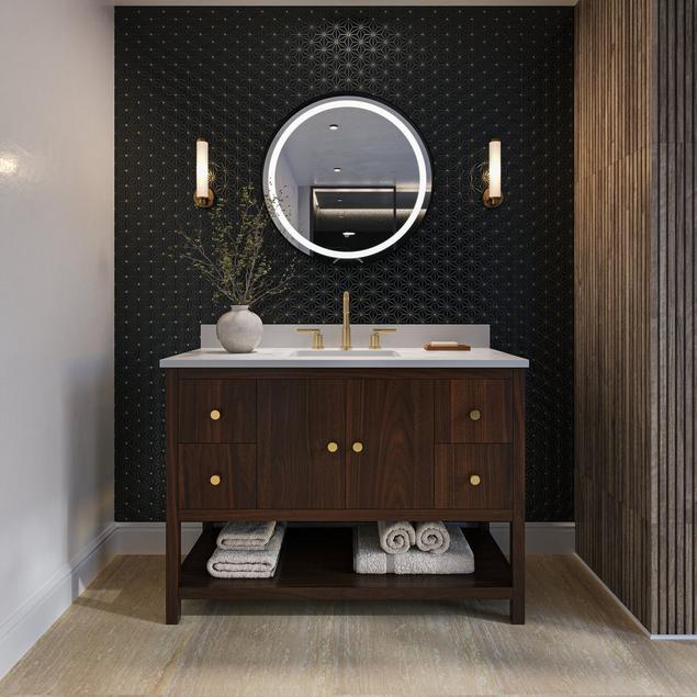 Bathroom with walnut vanity, travertine floor tile, and black mosaic backsplash.